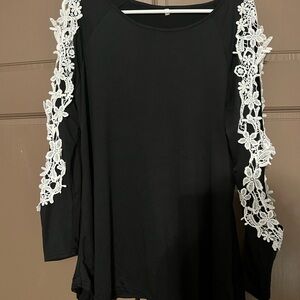 Elegant Black Top with White Lace Sleeves